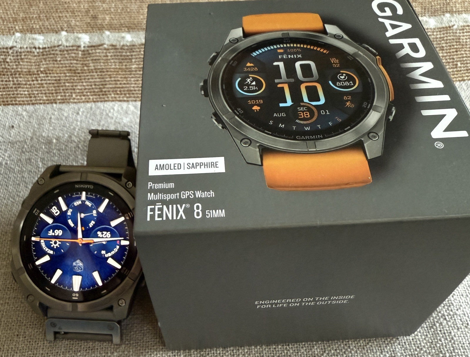 Garmin fenix 8 Amoled Sapphire 51 mm Watch Titanium w Spark Orange Silicone Band